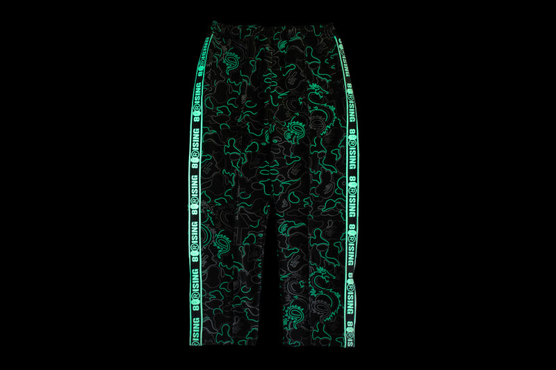 BAPE X 88RISING GLOW IN THE DARK CAMO TRACK PANTS